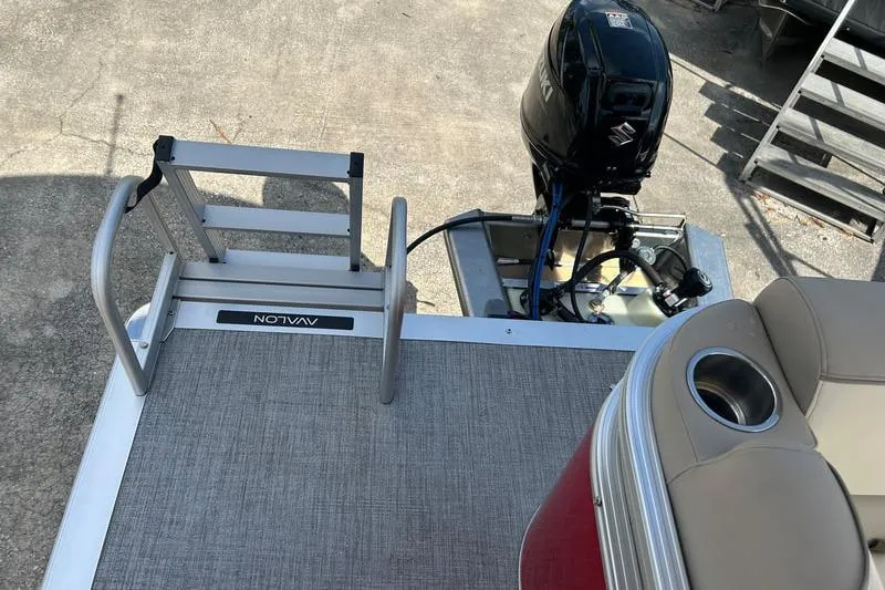 Slide: The Image of 2025 Avalon VENTURE CRUISE boat deck with motor and seating area. - 6