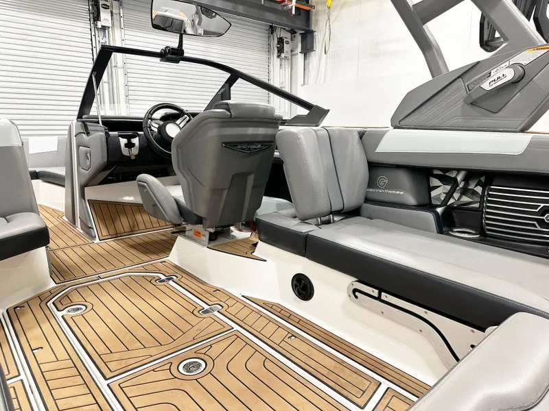 Slide: The Image of 2020 Nautique Super Air G23 interior with sleek seating and modern dashboard design. - 7