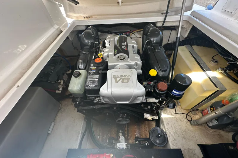 Slide: The Image of 2016 Monterey 295 Sport Yacht interior with white seating and sleek design. - 101