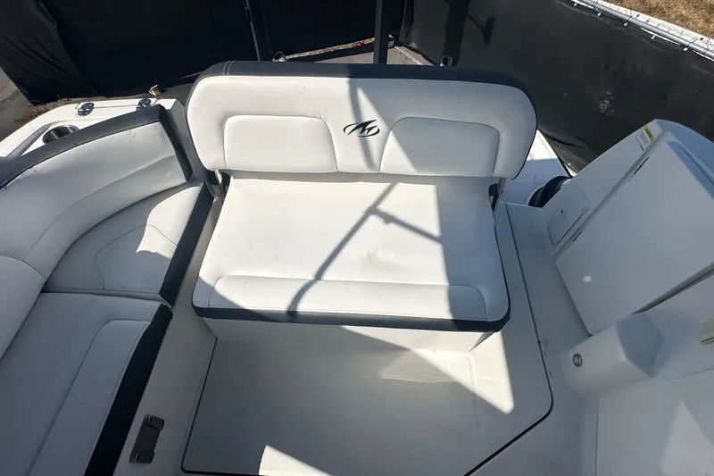 Slide: The Image of 2016 Monterey 295 Sport Yacht interior with white seating and road view. - 105