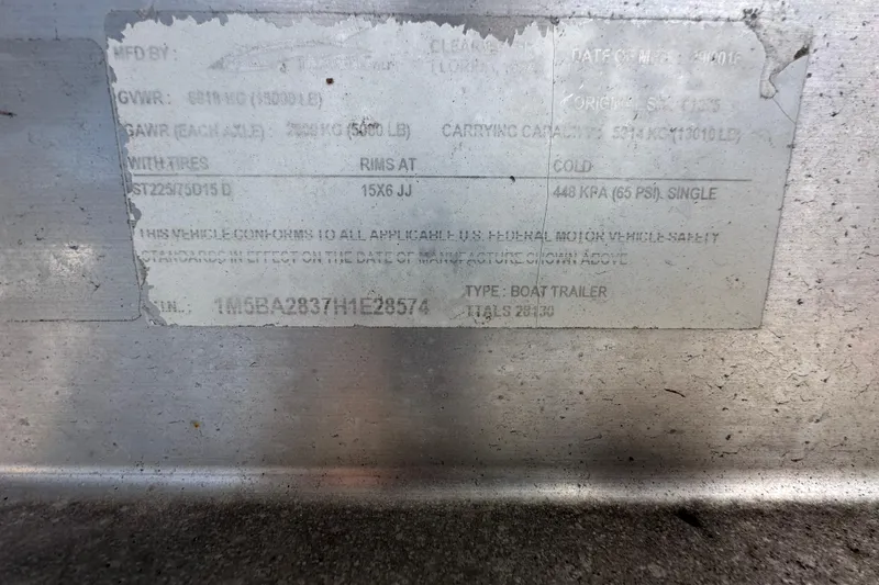 Slide: The Image of 2016 Monterey 295 Sport Yacht interior with white seating and black accents. - 108