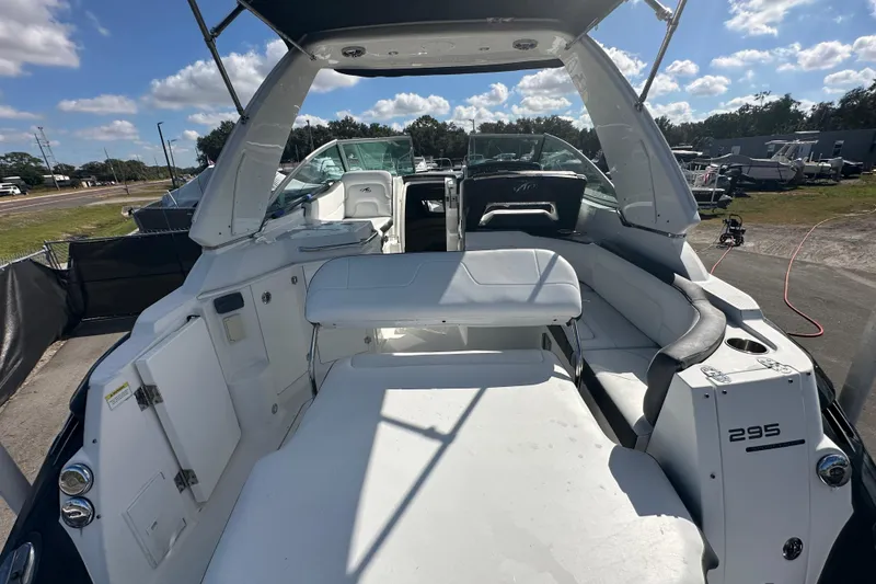 Slide: The Image of Trailer wheels of a 2016 Monterey 295 Sport Yacht on asphalt surface. - 13