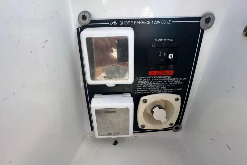 Slide: The Image of 2016 Monterey 295 Sport Yacht interior with white seating and storage compartments. - 17