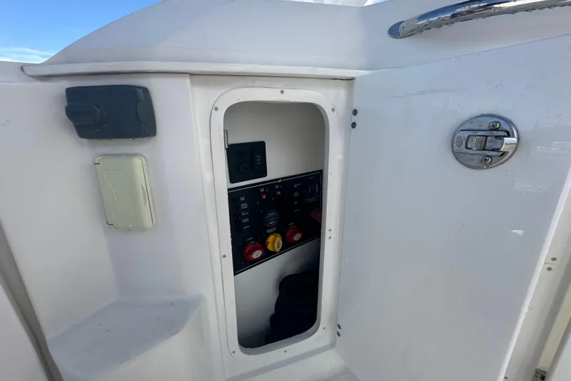 Slide: The Image of 2016 Monterey 295 Sport Yacht rear view, showcasing sleek design and branding details. - 19