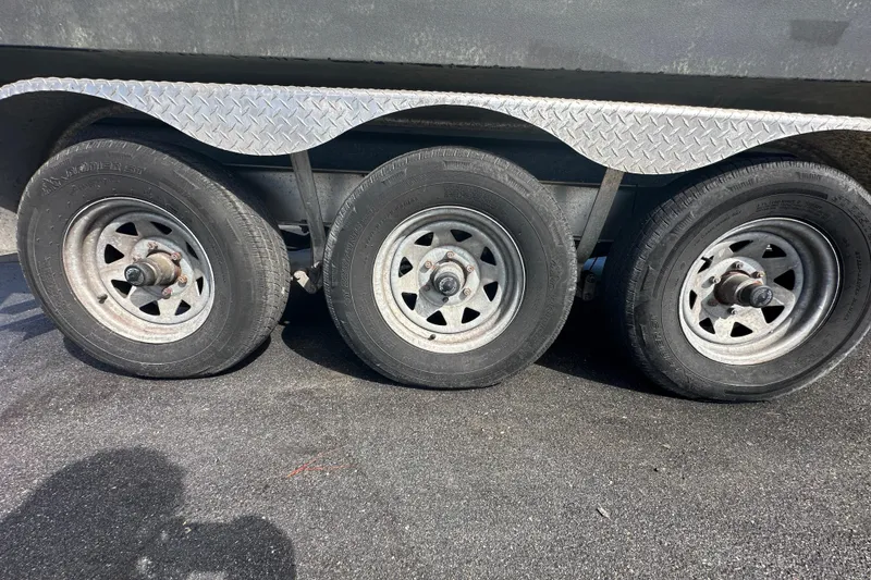 Slide: The Image of 2016 Monterey 295 Sport Yacht on trailer under clear blue sky. - 2