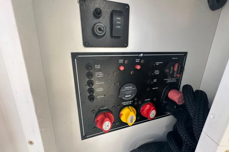 Slide: The Image of Shore power panel on 2016 Monterey 295 Sport Yacht with Hubbell outlet and warning instructions. - 20
