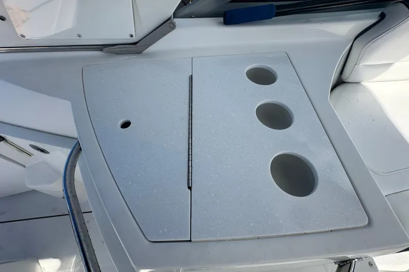 Slide: The Image of 2016 Monterey 295 Sport Yacht electrical panel with open access door. - 22