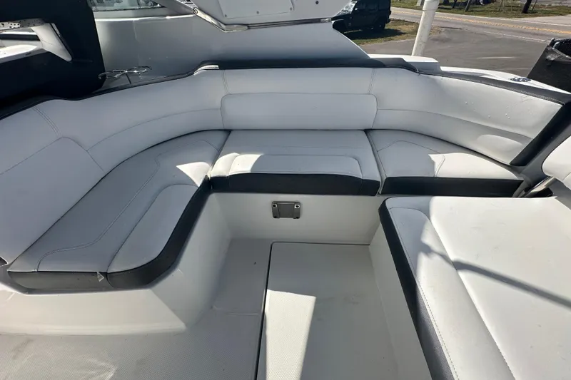 Slide: The Image of Open storage compartment on a 2016 Monterey 295 Sport Yacht, showing interior space. - 24