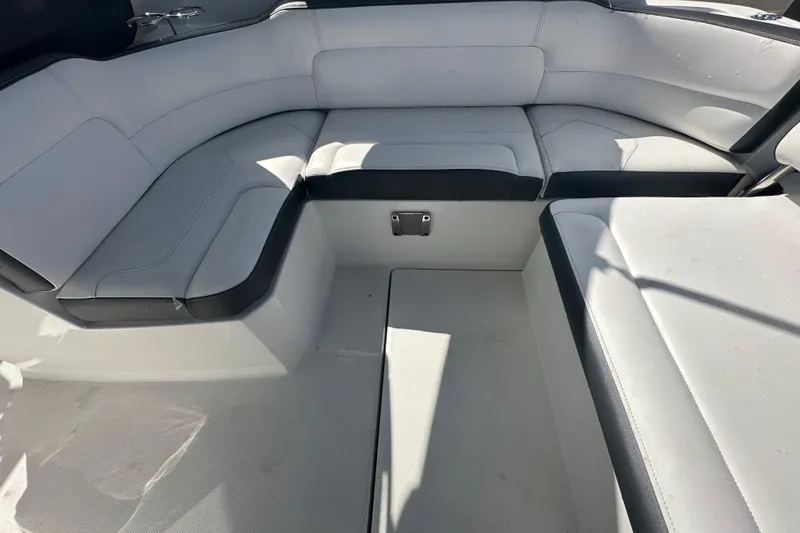 Slide: The Image of 2016 Monterey 295 Sport Yacht table with cup holders and storage compartment. - 25