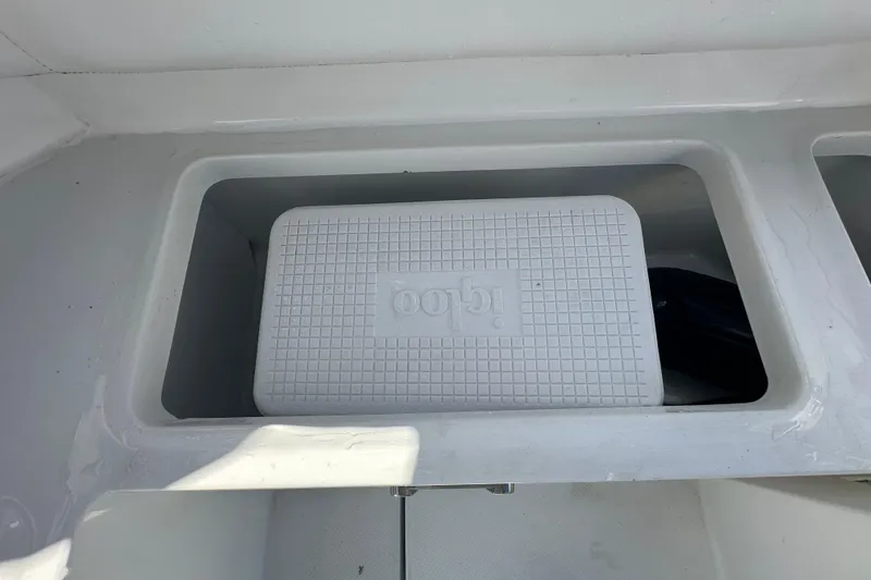 Slide: The Image of 2016 Monterey 295 Sport Yacht interior with white cushioned seating. - 28