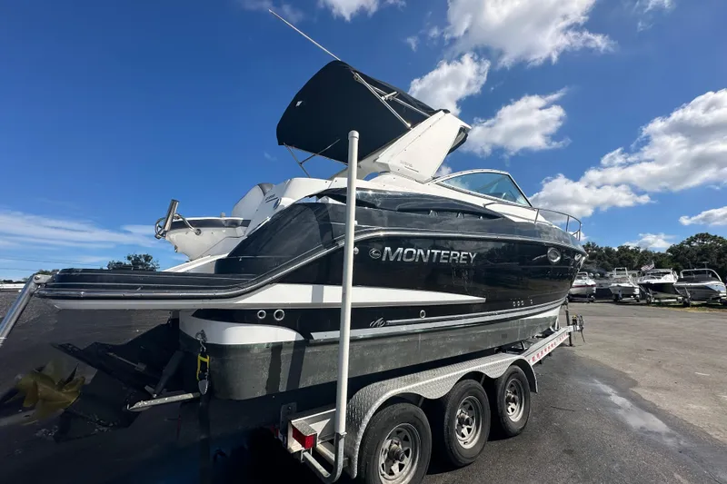 Slide: The Image of 2016 Monterey 295 Sport Yacht on trailer, showing stern and propeller. - 3