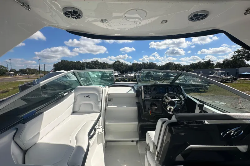 Slide: The Image of Storage compartment on a 2016 Monterey 295 Sport Yacht, featuring a lock and cooler. - 30