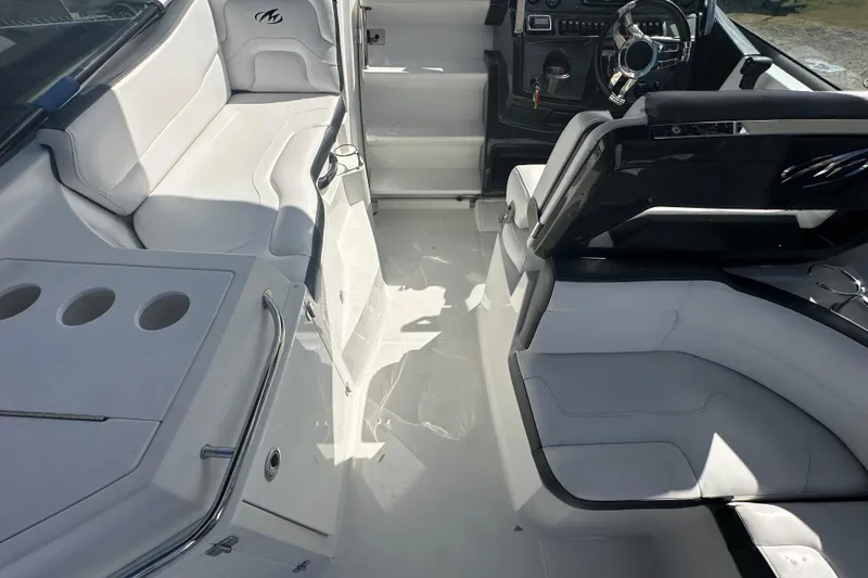 Slide: The Image of Storage compartment on 2016 Monterey 295 Sport Yacht with coiled ropes and red reel. - 32