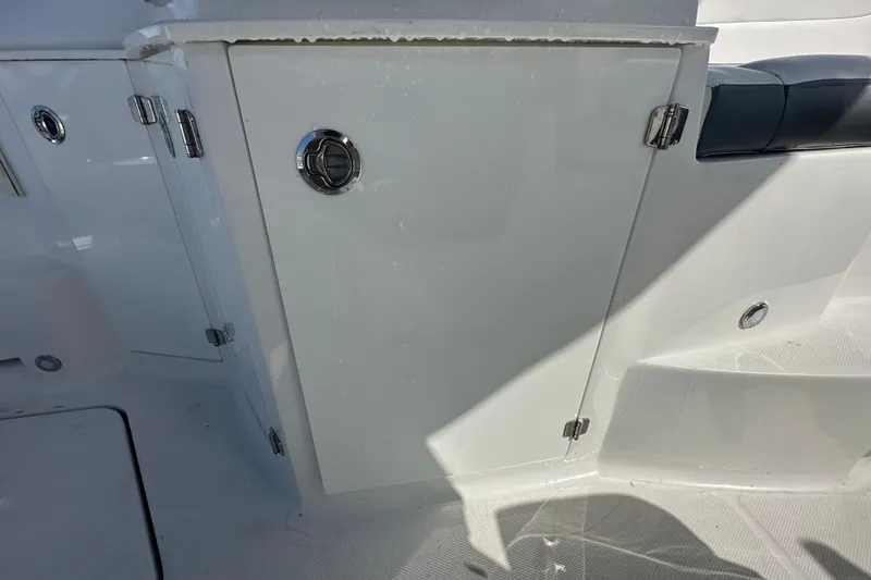 Slide: The Image of 2016 Monterey 295 Sport Yacht interior with sleek seating and modern dashboard. - 34