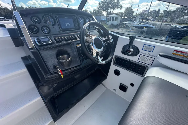 Slide: The Image of 2016 Monterey 295 Sport Yacht interior cabinet with sleek white finish and chrome handle. - 37