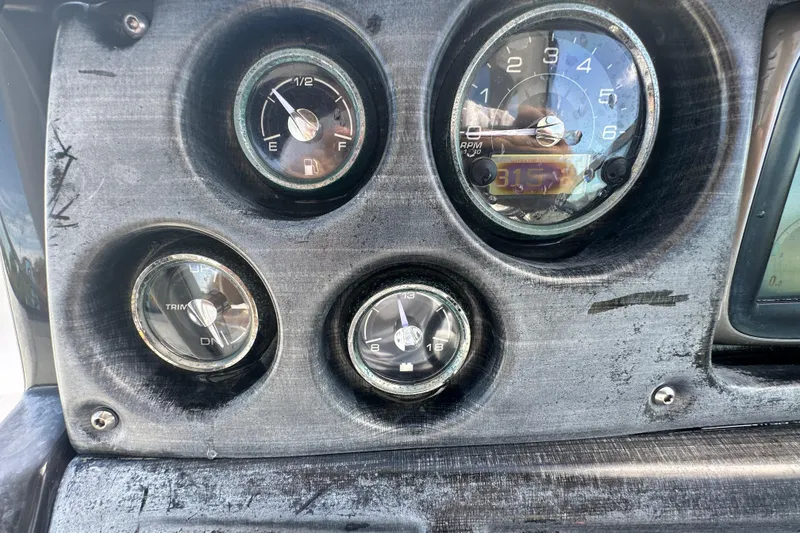 Slide: The Image of Cockpit of 2016 Monterey 295 Sport Yacht with steering wheel and control panel. - 40