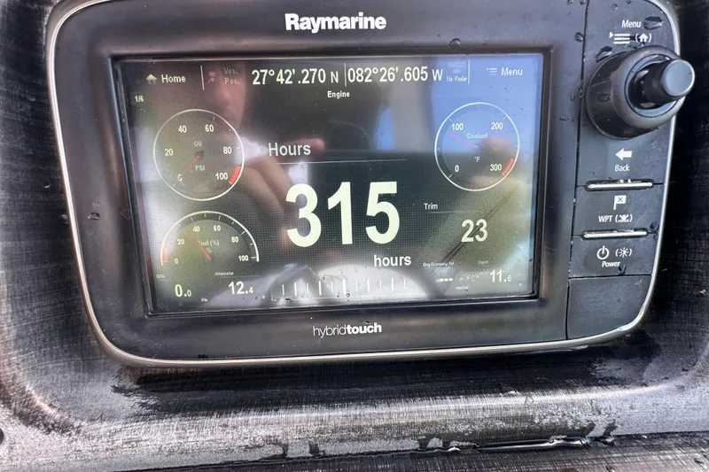 Slide: The Image of 2016 Monterey 295 Sport Yacht dashboard with steering wheel and instrument panel. - 41