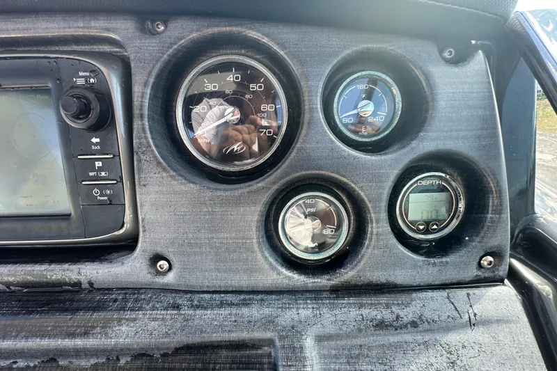 Slide: The Image of Steering console of 2016 Monterey 295 Sport Yacht with gauges and controls. - 42