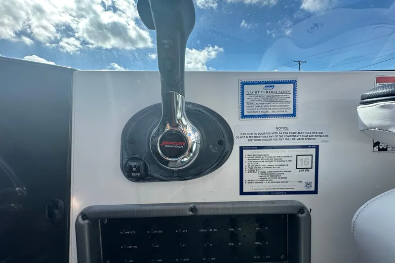 Slide: The Image of Control panel switches on a 2016 Monterey 295 Sport Yacht dashboard. - 47