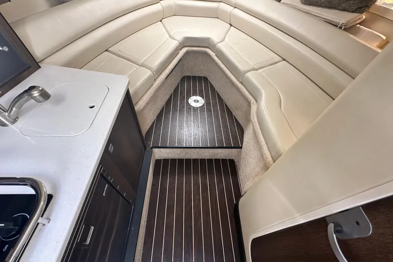 Slide: The Image of Interior of 2016 Monterey 295 Sport Yacht with kitchenette and seating area. - 52