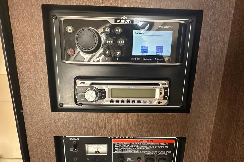 Slide: The Image of Luxurious interior of 2016 Monterey 295 Sport Yacht with plush seating and modern kitchenette. - 54