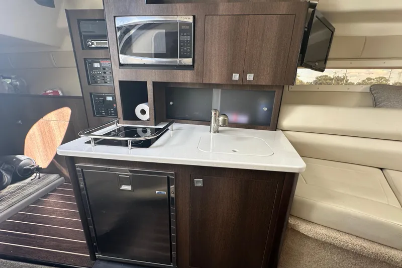 Slide: The Image of Control panel of a 2016 Monterey 295 Sport Yacht, featuring switches and indicators. - 58