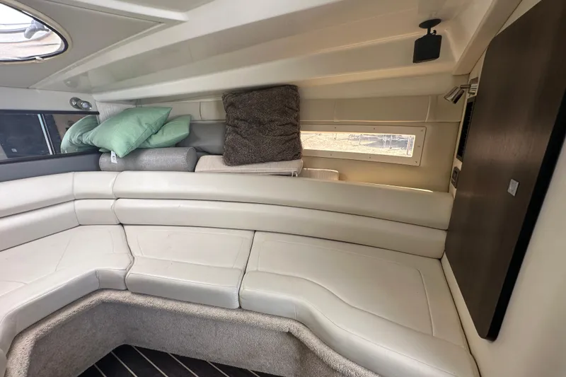 Slide: The Image of Compact kitchen area in 2016 Monterey 295 Sport Yacht with stove, sink, and microwave. - 63