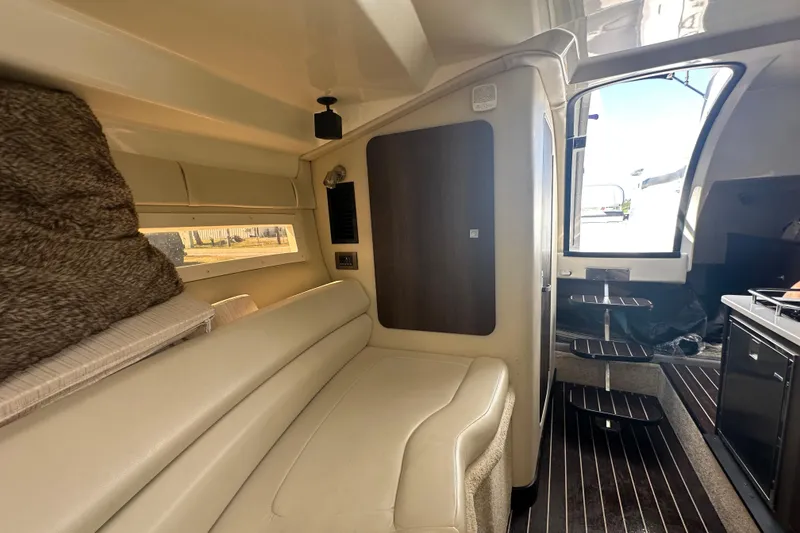Slide: The Image of Interior of 2016 Monterey 295 Sport Yacht with modern kitchen and seating area. - 67