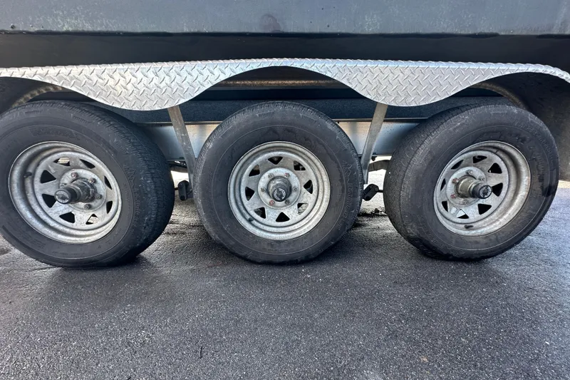 Slide: The Image of 2016 Monterey 295 Sport Yacht on trailer under a sunny sky. - 8