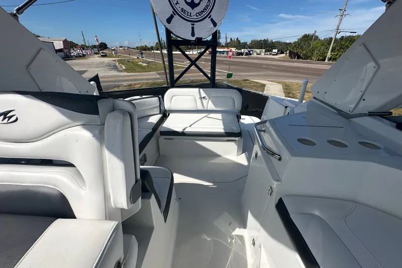 Slide: The Image of Captain's seat on 2016 Monterey 295 Sport Yacht, featuring sleek white and gray design. - 95