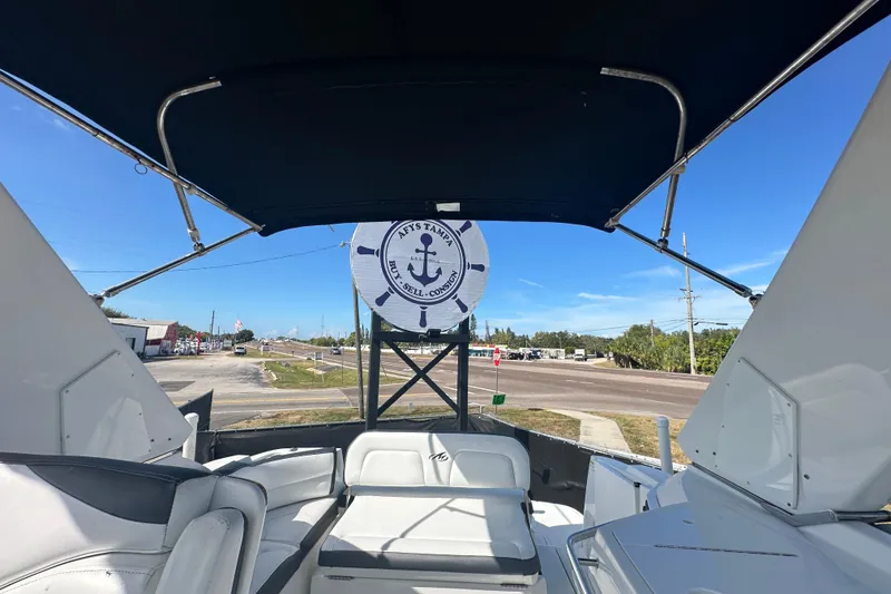 Slide: The Image of 2016 Monterey 295 Sport Yacht interior with white seating and sleek design. - 97