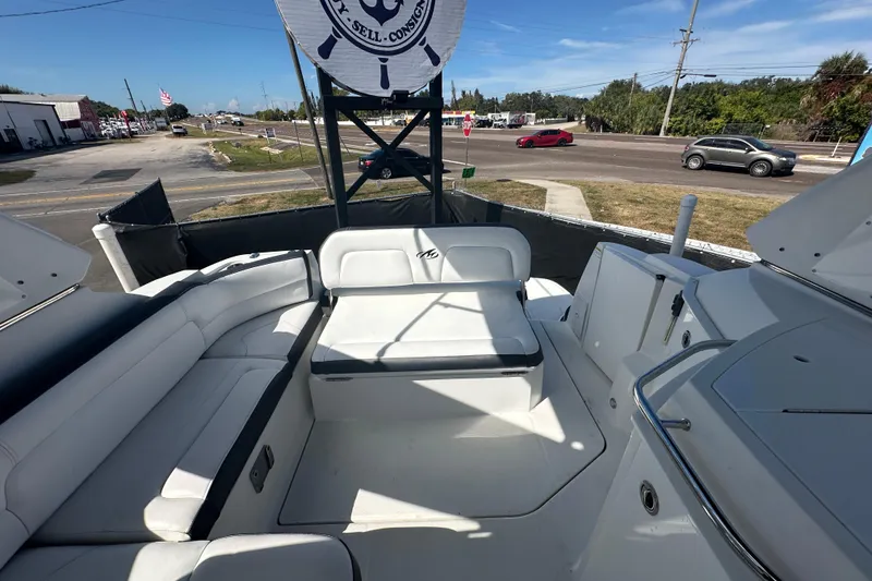 Slide: The Image of Interior of a 2016 Monterey 295 Sport Yacht, featuring sleek white seating and modern design. - 98