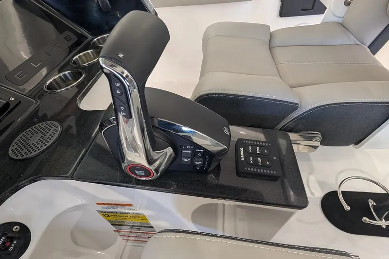 Slide: The Image of 2026 Monterey Elite 25 OB boat interior with control panel and seating. - 15