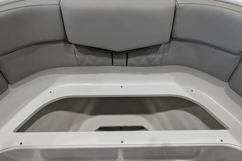 Slide: The Image of Interior seating of 2026 Monterey Elite 25 OB boat, featuring gray upholstery. - 24
