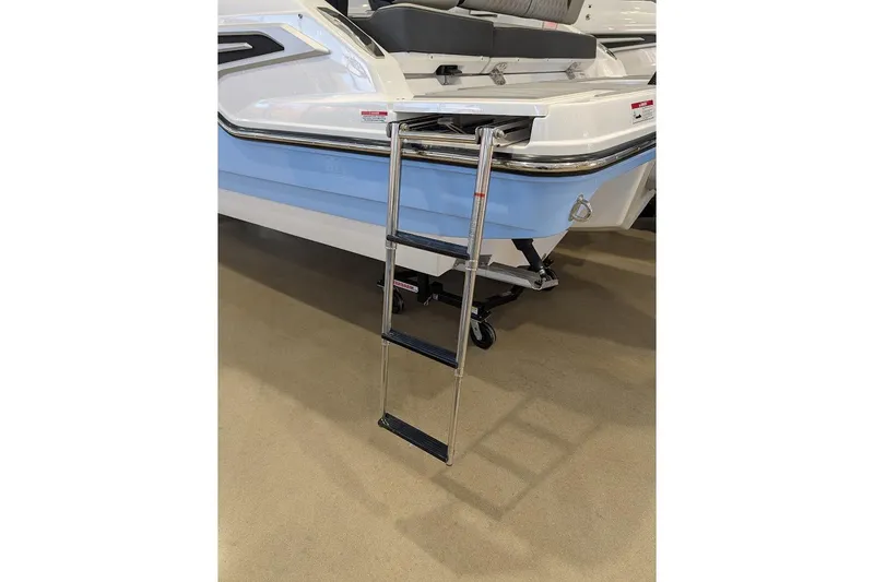 Slide: The Image of 2026 Monterey Elite 25 OB boat with a retractable swim ladder. - 3