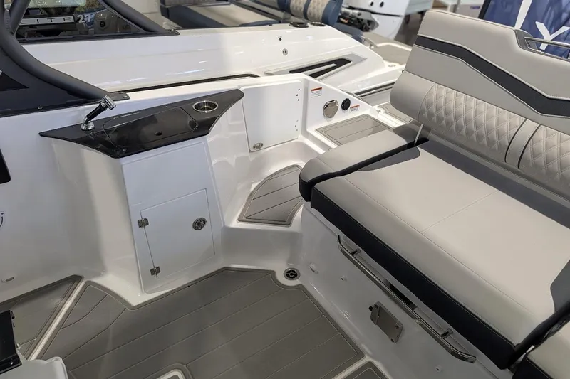 Slide: The Image of 2026 Monterey Elite 25 OB boat interior with sleek seating and modern design. - 8