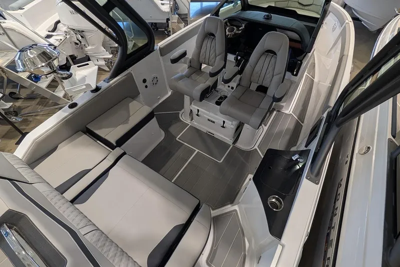 Slide: The Image of 2026 Monterey Elite 25 OB boat interior with modern seating and sleek design. - 9