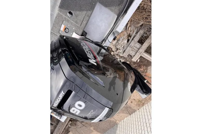 Slide: The Image of 2024 Alumacraft Competitor 165 Sport with Mercury 90 HP outboard engine. - 2