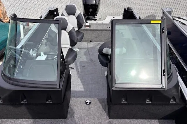 Slide: The Image of 2024 Alumacraft Competitor 165 Sport interior with dual consoles and seating. - 6