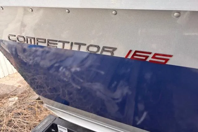 Slide: The Image of 2024 Alumacraft Competitor 165 Sport boat, close-up of model name on hull. - 8