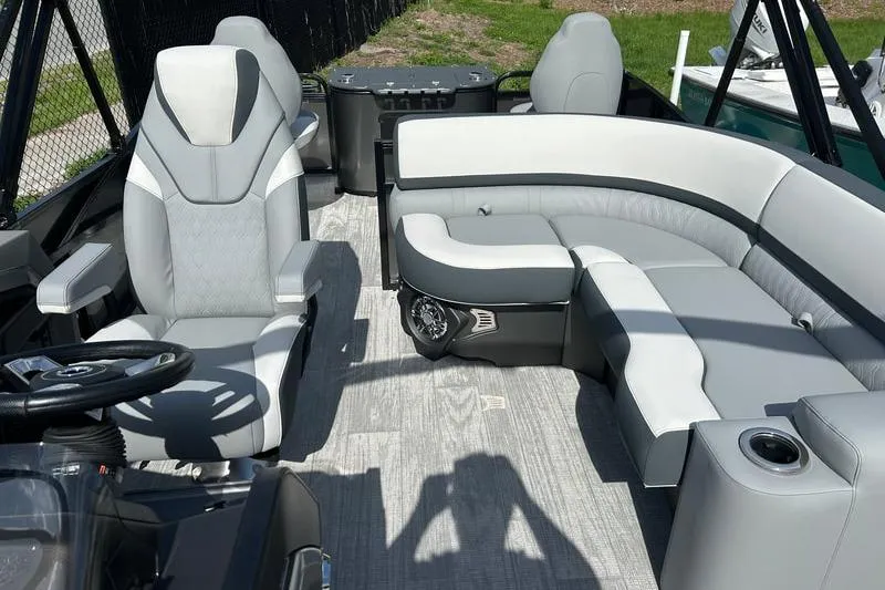Slide: The Image of 2025 Avalon Catalina Rear Fish boat interior with modern seating and steering wheel. - 4