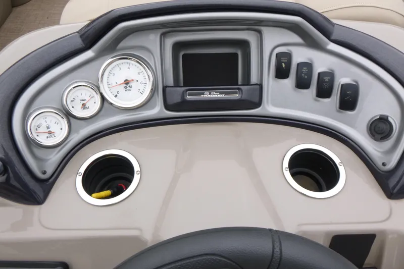 Slide: The Image of 2023 Sun Tracker Party Barge 20 DLX dashboard with gauges and controls. - 14