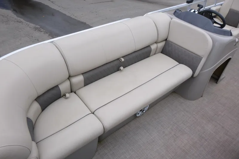 Slide: The Image of 2023 Sun Tracker Party Barge 20 DLX interior seating with beige upholstery. - 19