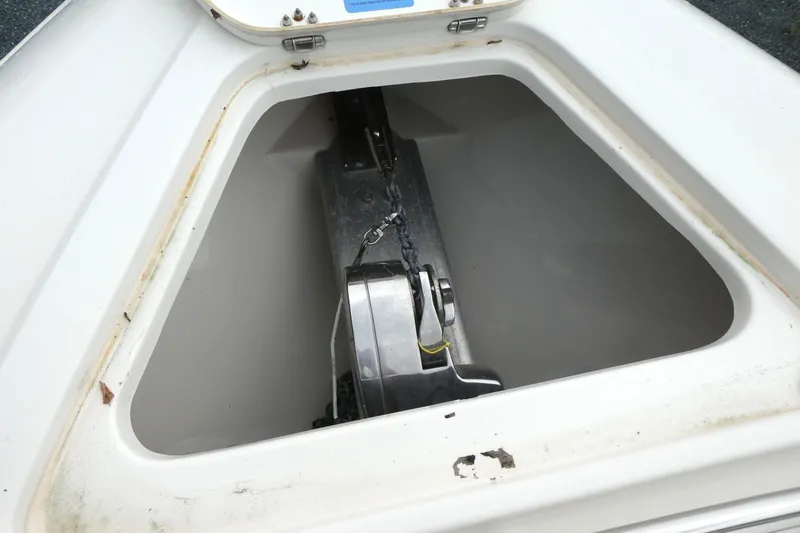 Slide: The Image of Anchor compartment of 2012 ShearWater 26 boat, featuring a secure anchor storage. - 12