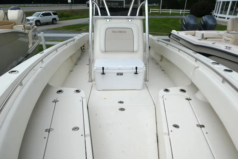 Slide: The Image of 2012 ShearWater 26 boat interior with Yeti cooler on deck. - 13