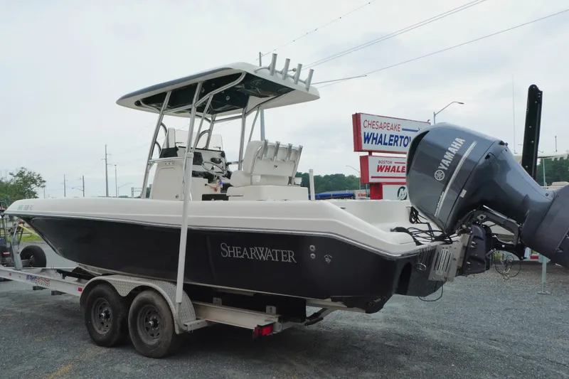 Slide: The Image of 2012 ShearWater 26 boat on trailer with Yamaha outboard motor at dealership. - 3