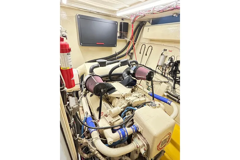 Slide: The Image of Engine room of 1979 Hatteras 53 Motor Yacht Hard Top with visible components. - 101