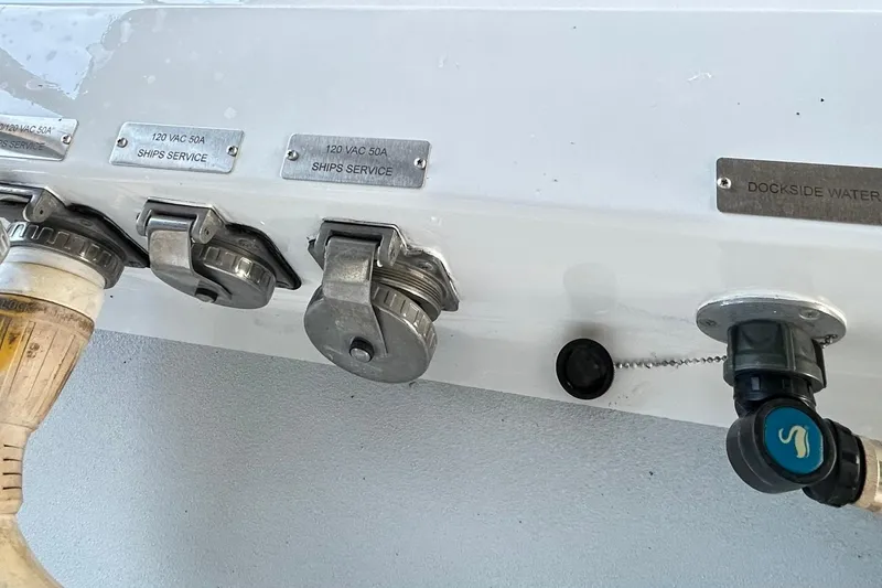 Slide: The Image of Electrical and water connections on a 1979 Hatteras 53 Motor Yacht Hard Top. - 126