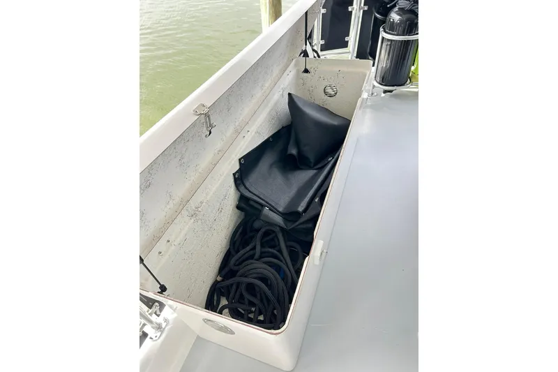 Slide: The Image of Storage compartment on 1979 Hatteras 53 Motor Yacht Hard Top with ropes and cover. - 134