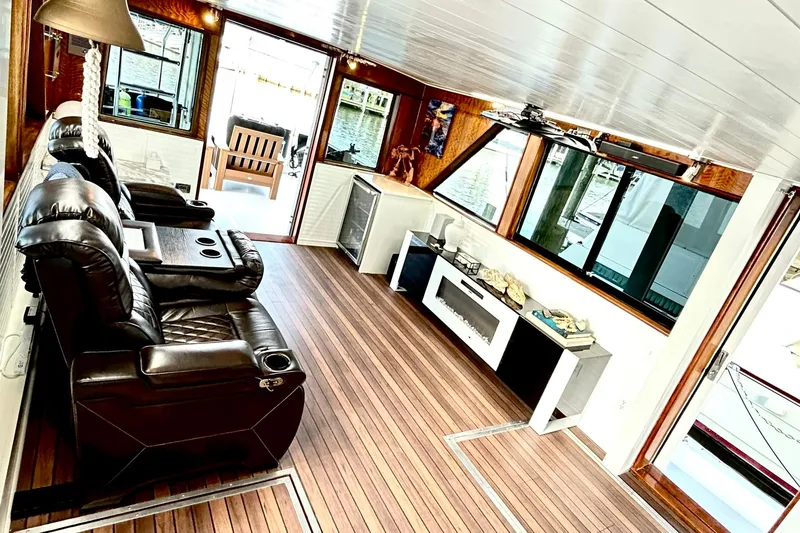 Slide: The Image of Interior of 1979 Hatteras 53 Motor Yacht with leather recliners and wood flooring. - 22